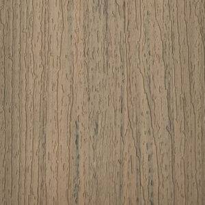 TREX Enhance Basics Honey Grove Deck Board Close-Up – A detailed close-up of the TREX Enhance Basics Honey Grove composite decking, showcasing its natural wood-grain texture in a warm, golden brown tone.