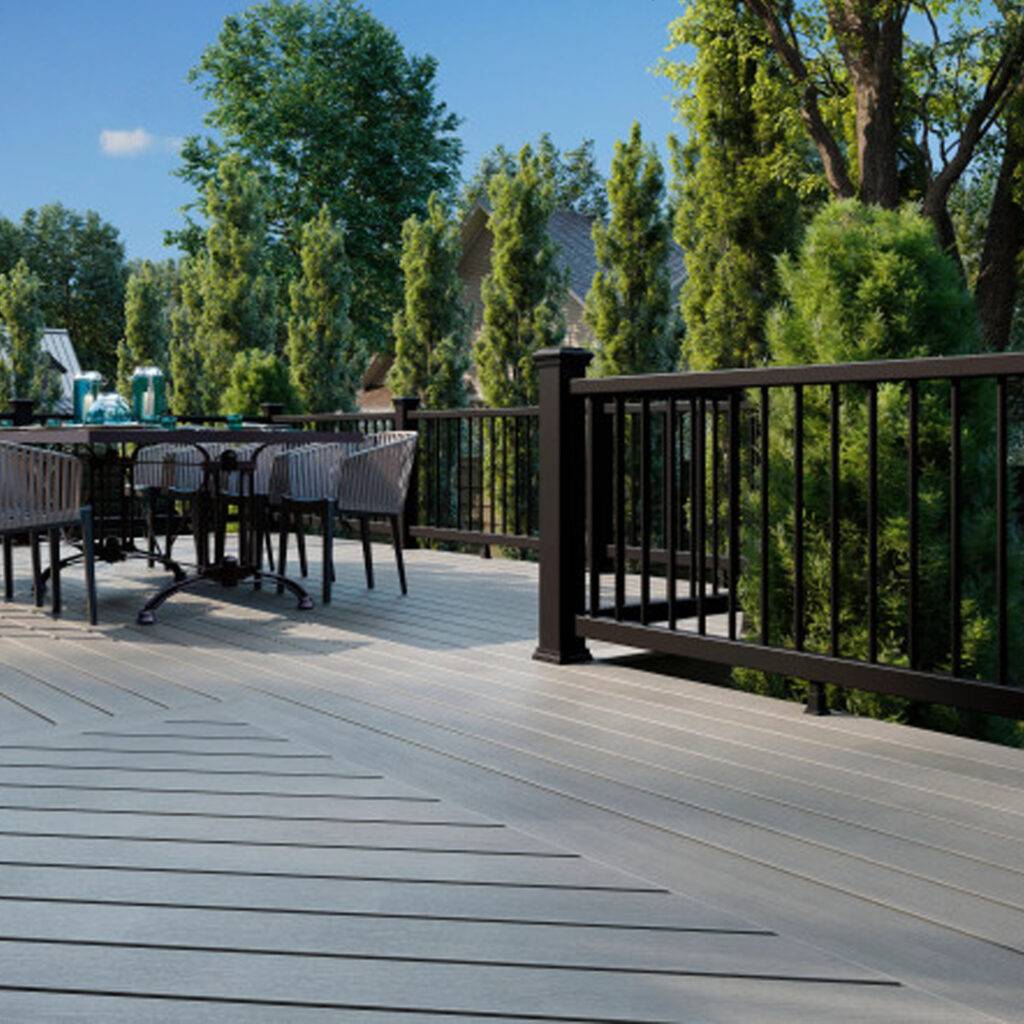 Low-maintenance composite decking with black railing for backyard use
