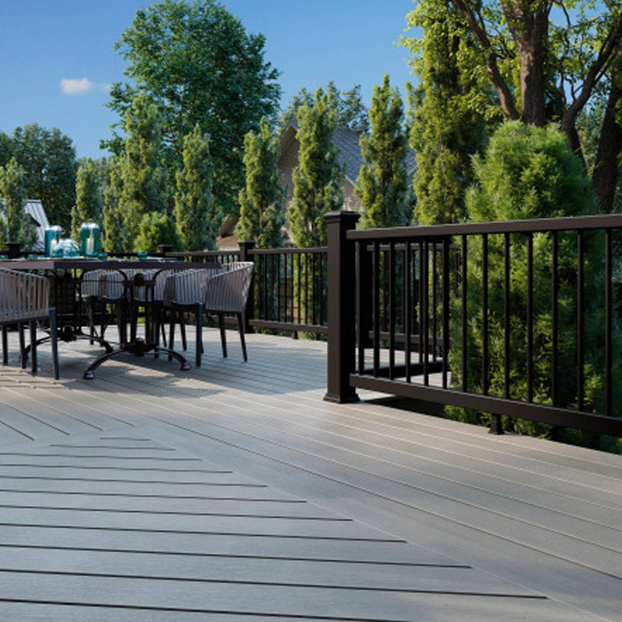 Low-maintenance composite decking with black railing for backyard use