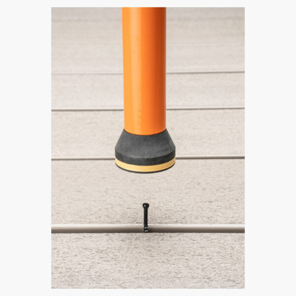 CAMO ClipDRIVE installation tool securing CAMO Wedge Metal Clips into grooved decking on a metal frame.