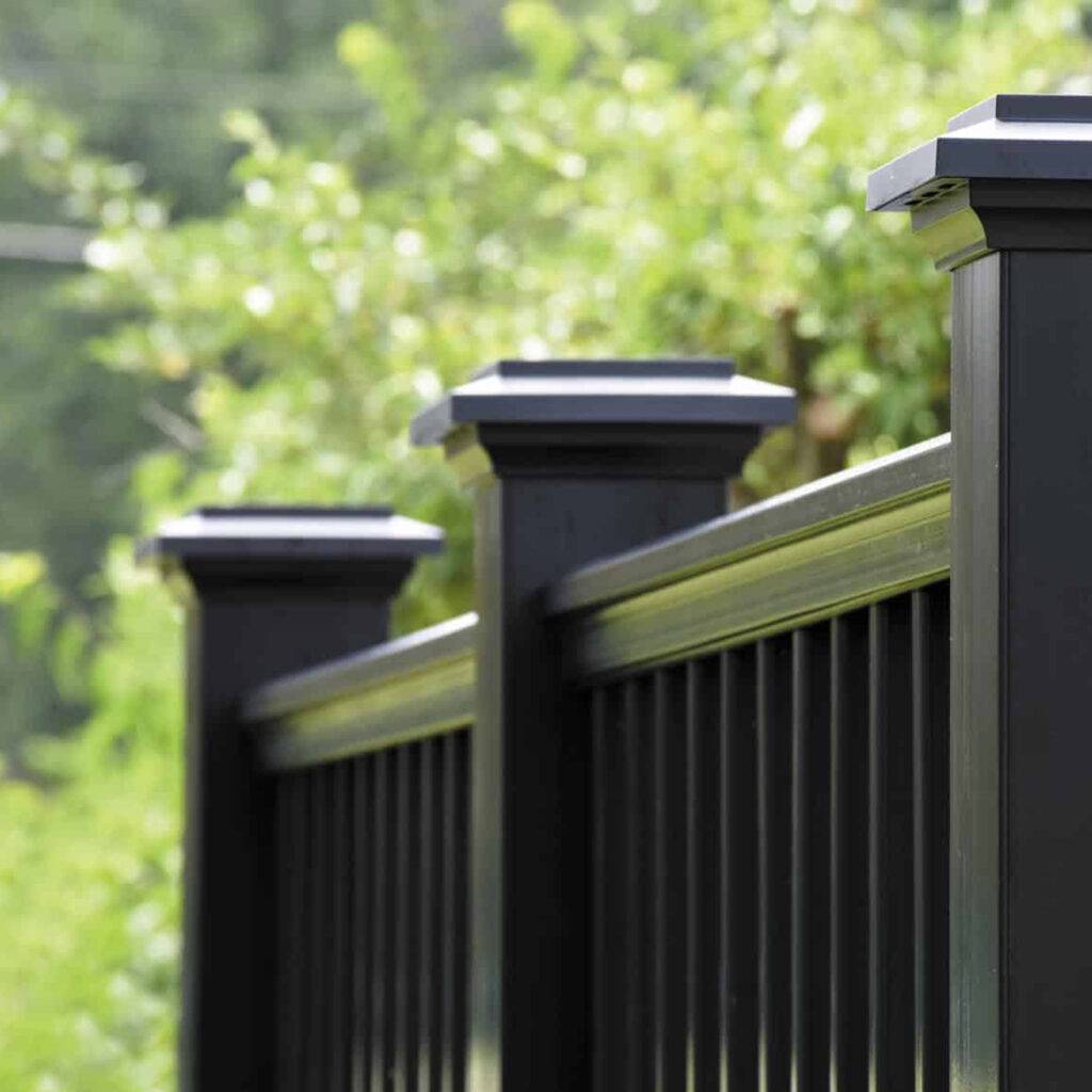 TimberTech Premier Rail composite rail with a traditional, substantial handrail design, adding a classic touch to an outdoor deck.
