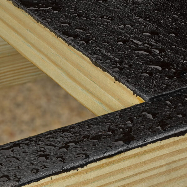 Close-up of water beading off coated deck joist